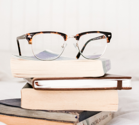 glasses on top of books
