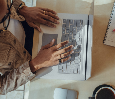 Woman typing on a laptop