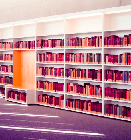 Books stacked on library shelves
