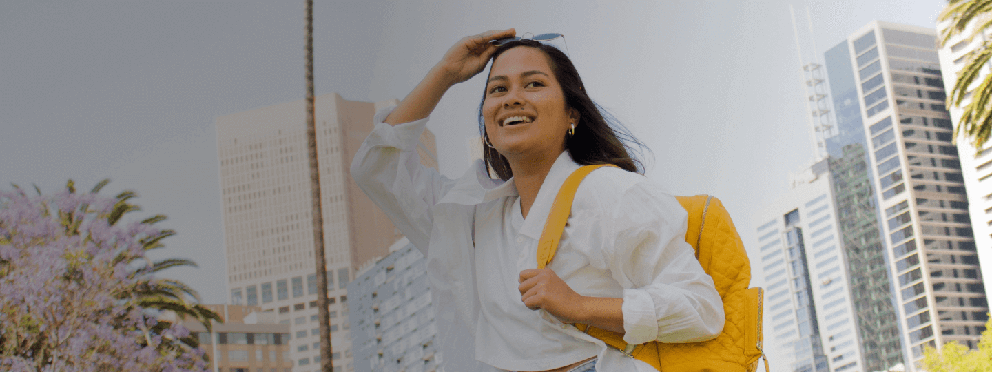Woman smiling while walking on the street 