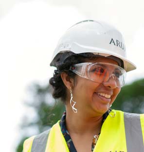 up close image of woman with hard hat on