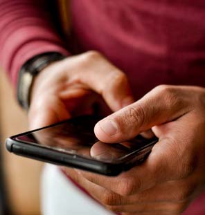 close up image of hands holding a phone