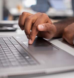 Hands click on mouse on laptop  keyboard