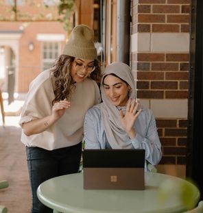 two females looking at laptop