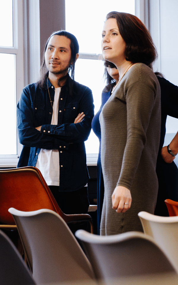 Group of people looking at computer