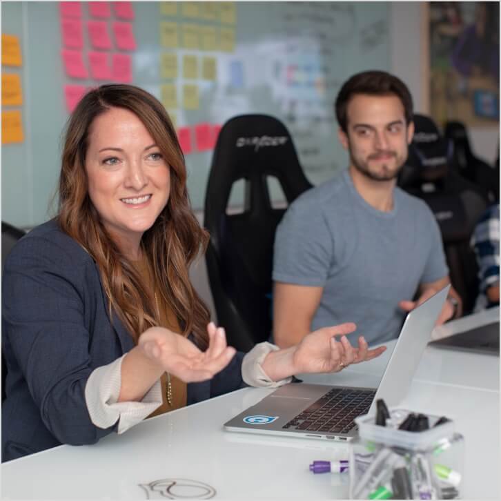 Woman leading discussion at a business meeting.