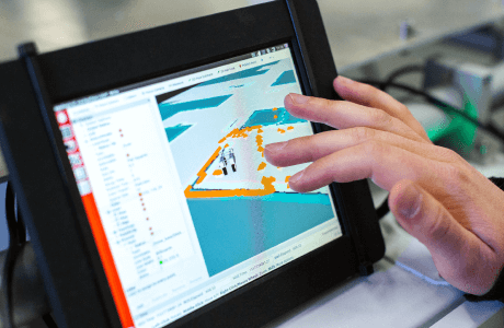 Close up of a person's hand accessing research on a tablet device