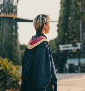 graduate standing in the street