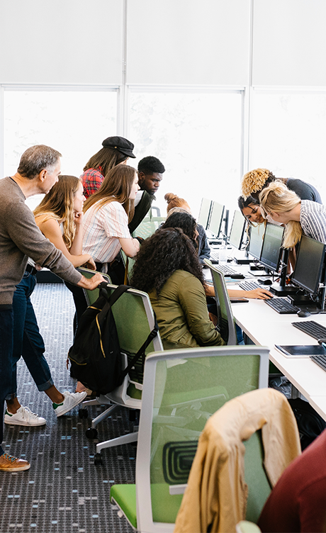Students around a computer looking at one screen