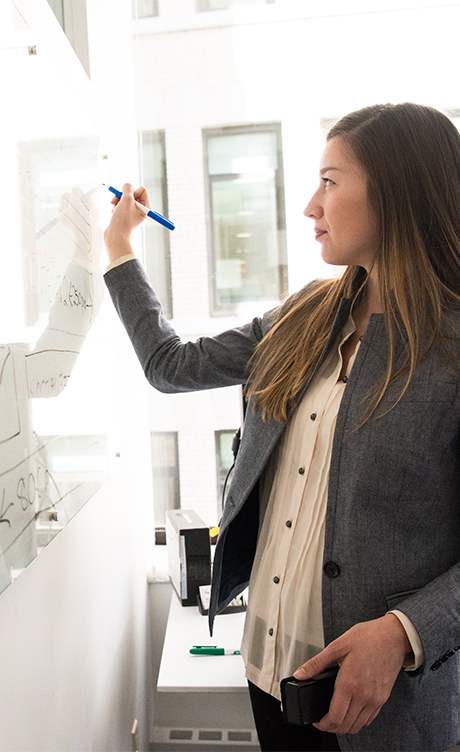 woman writting on a whiteboard