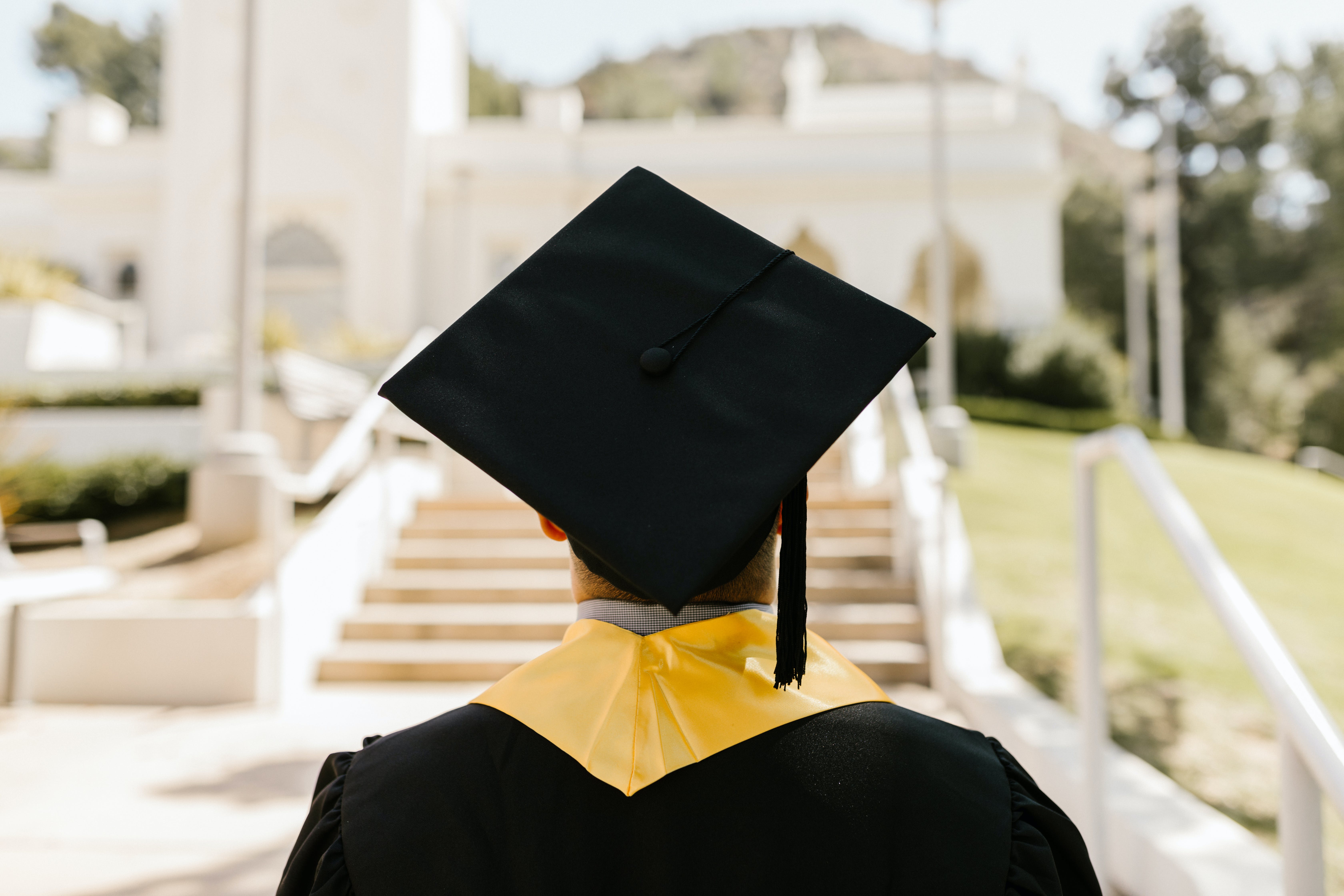 Man wearing graduation cap.